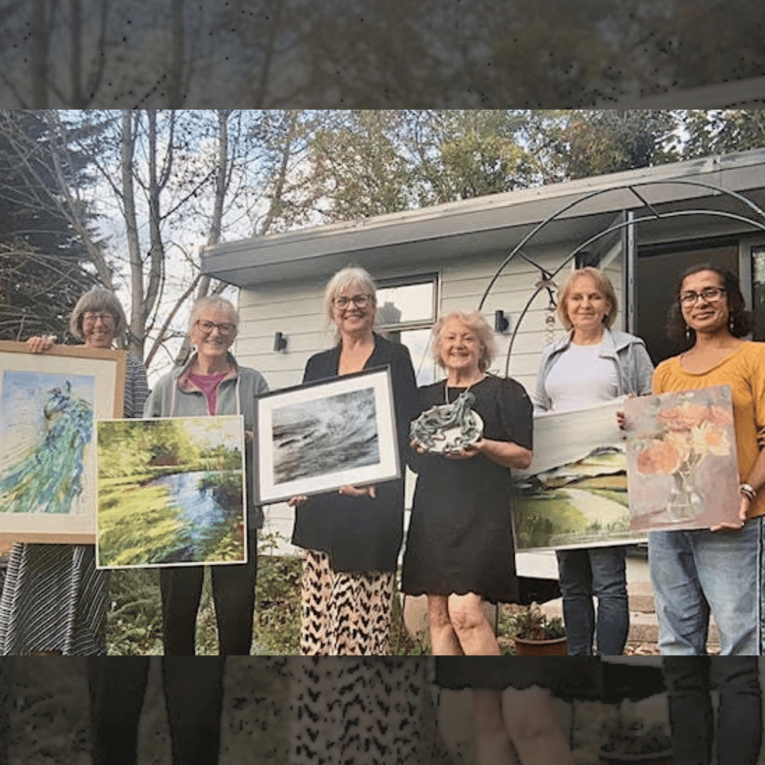 Just a few of the Acorn artists - standing outside, proudly holding their artwork